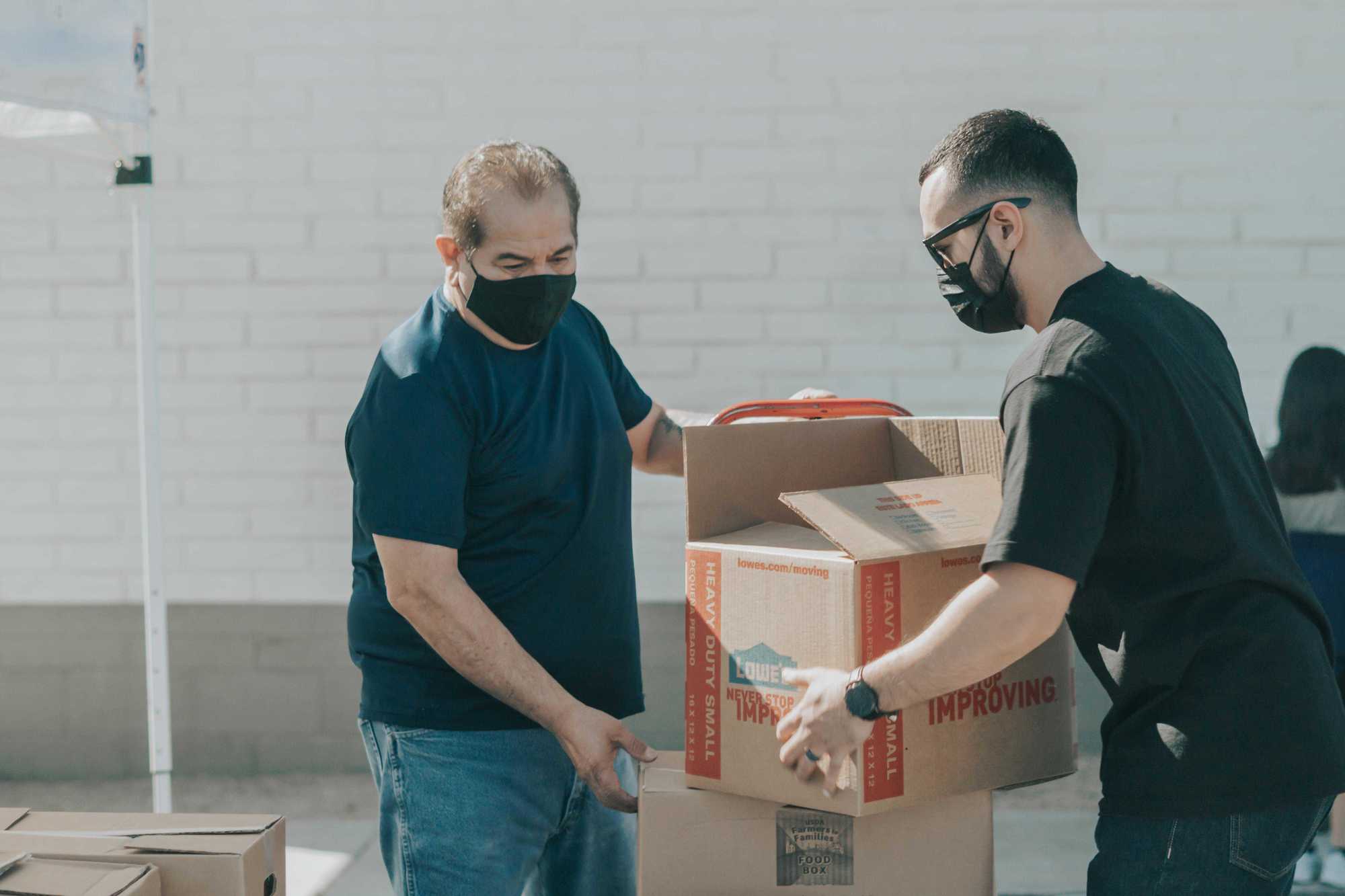 Volunteers packing donated goods