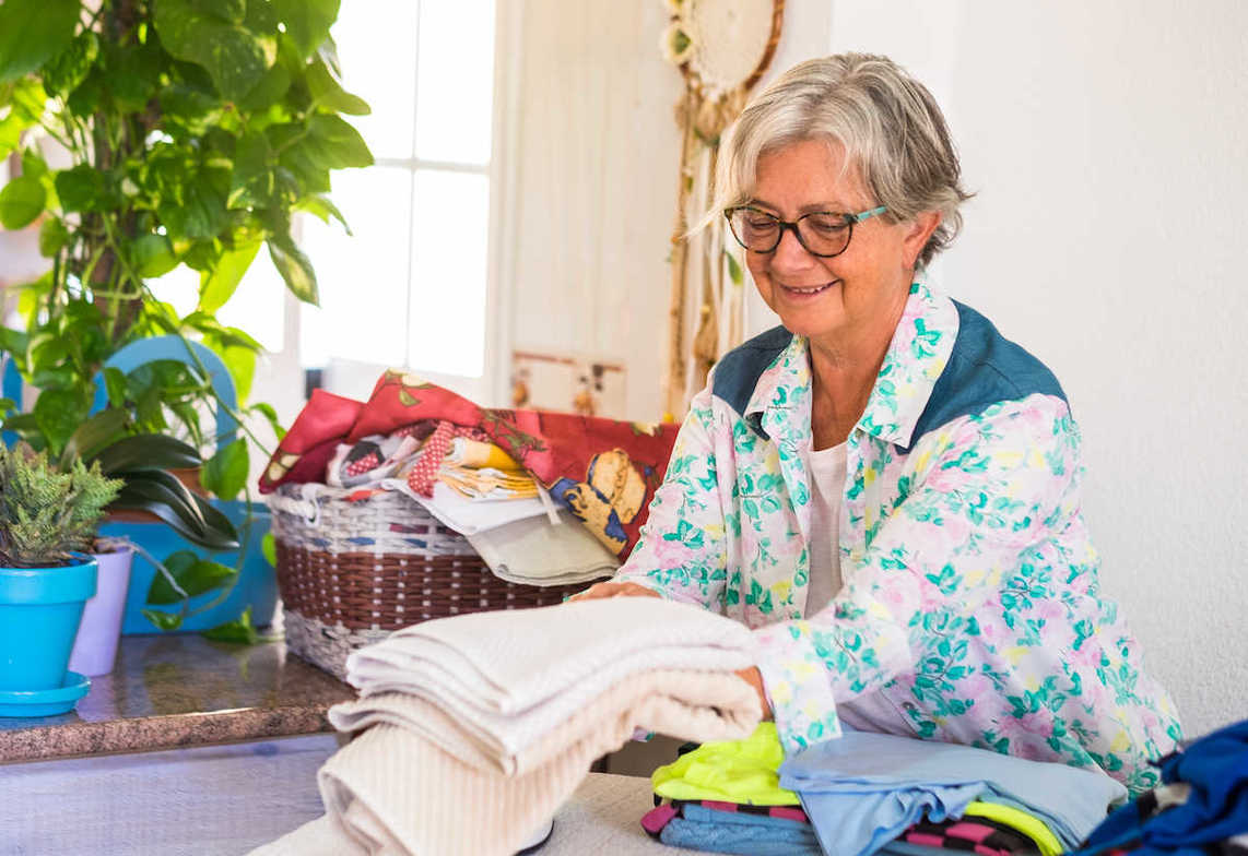 senior sorting out clothes